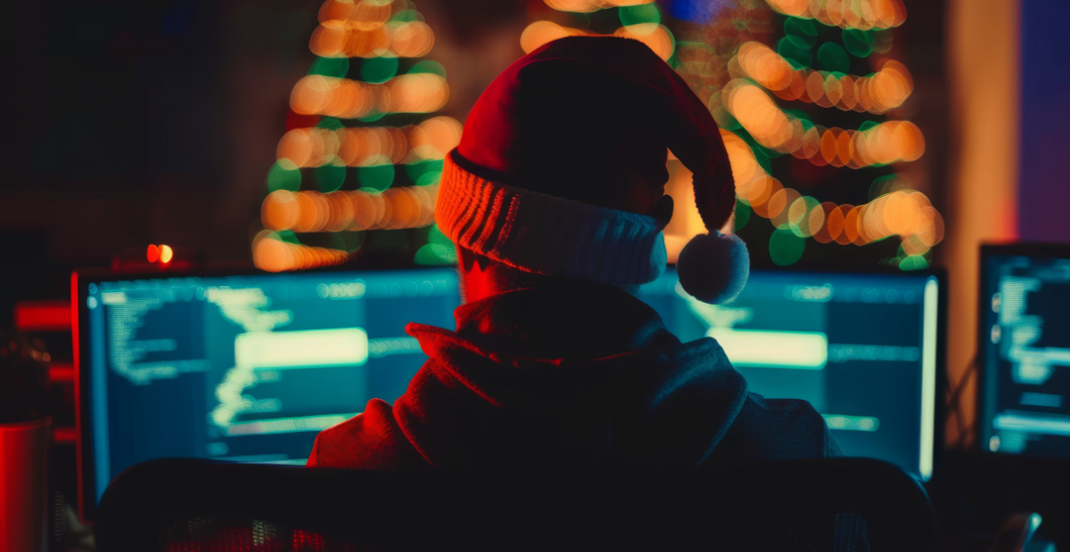 Holiday Risk Report: Hacker wearing a Santa hat representing cybercrime spikes in December
